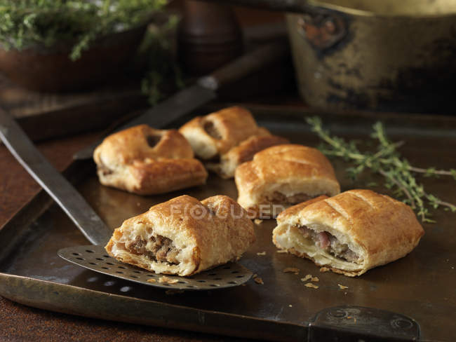 Christmas snack of gourmet sausage rolls — Stock Photo