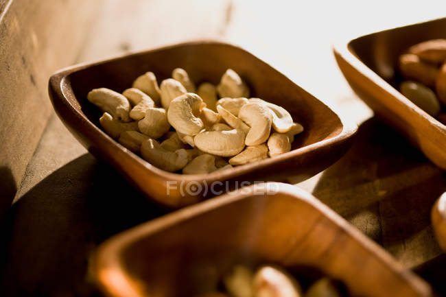 Cashew nuts in wooden bowls, close up shot — Stock Photo