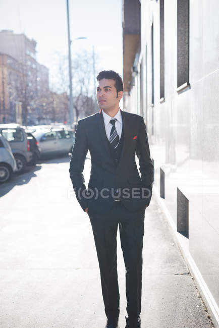 Young businessman in the street, Milan, Italy — Stock Photo