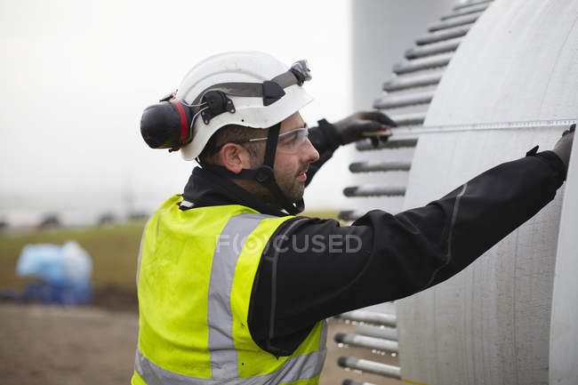 Engineer working on wind turbine construction site — Stock Photo
