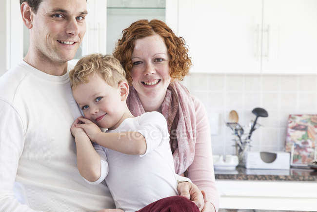 Portrait of mid adult couple and preschooler son — Stock Photo