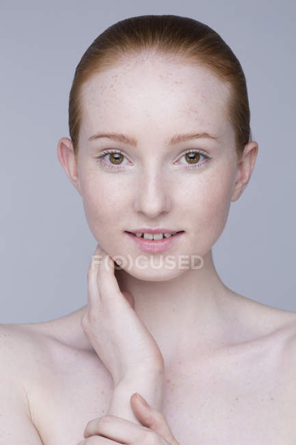 Close up portrait of young woman, hand on face — Stock Photo