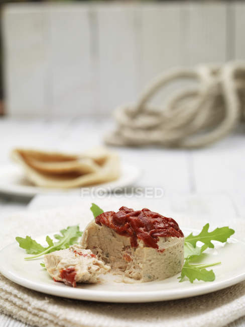 Plate of tuna terrine and roasted red peppers — Stock Photo