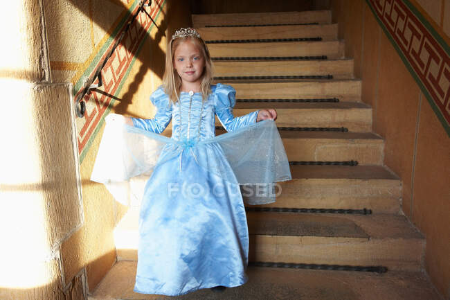 Princess climbing down the stairs — Stock Photo