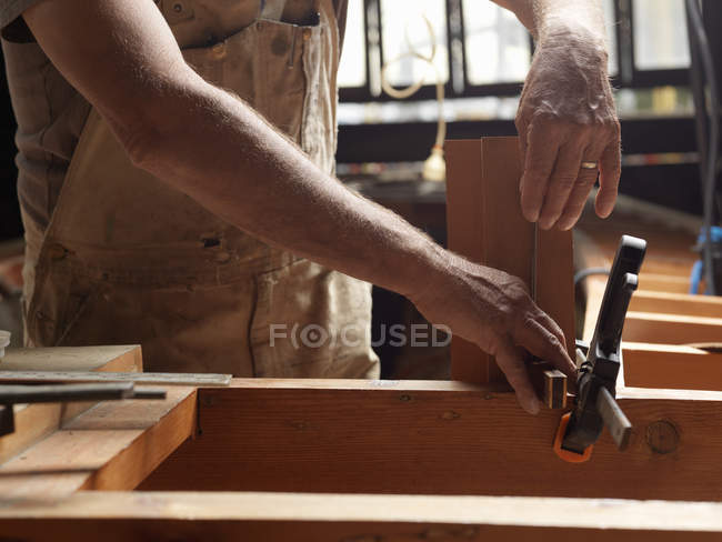 Cropped image of boat builder in workshop — Stock Photo