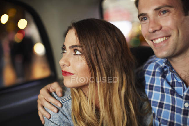 Couple going out in city taxi at night — Stock Photo