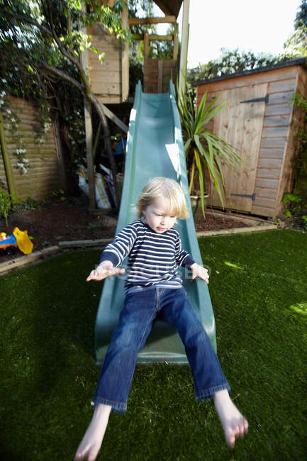 Young boy on a slide — Stock Photo
