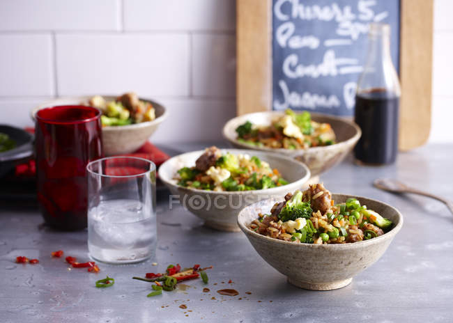 Cafe counter with bowls of fried rice — Stock Photo