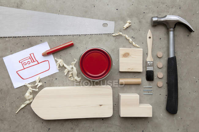 Drawing, paint and tools to make toy boat — Stock Photo