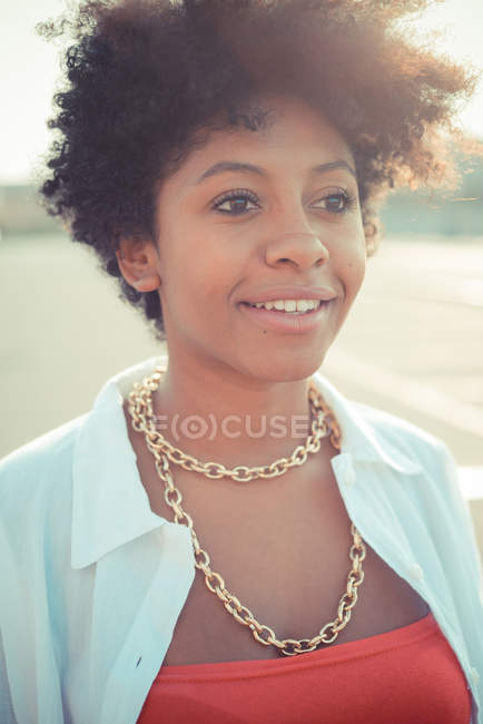 Portrait of young woman in city — Stock Photo