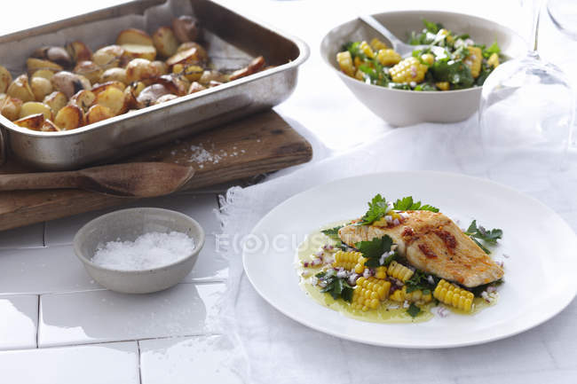 Fish fillet with corn — Stock Photo