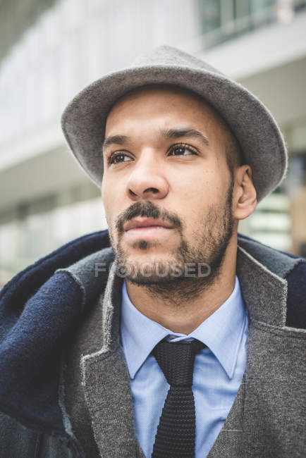 Close up portrait of businessman waiting outside office building — Stock Photo