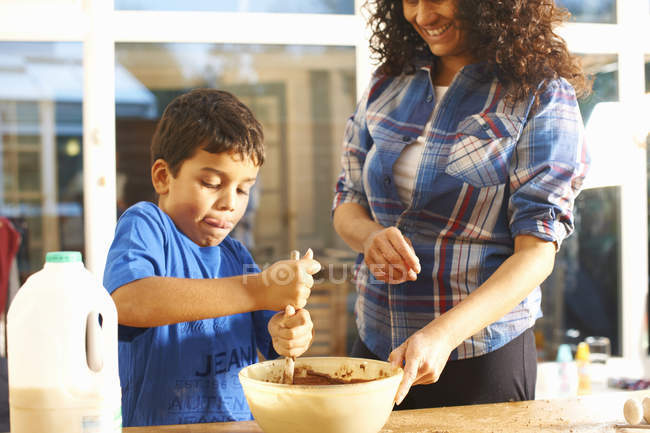 Mother and son baking in kitchen at home — Stock Photo