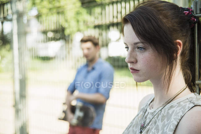 Young couple keeping distance in park after argument — Stock Photo