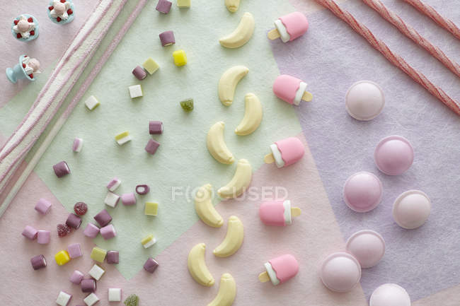 Multi-shaped coloured candies, high angle view — Stock Photo