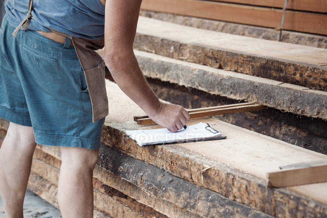 Cropped image of Carpenter working in workshop — Stock Photo