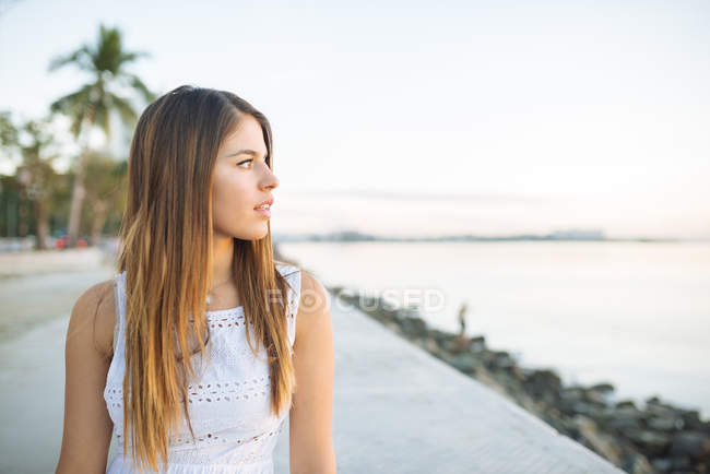 Young woman looking out from waterfront, Manila, Philippines — Stock Photo