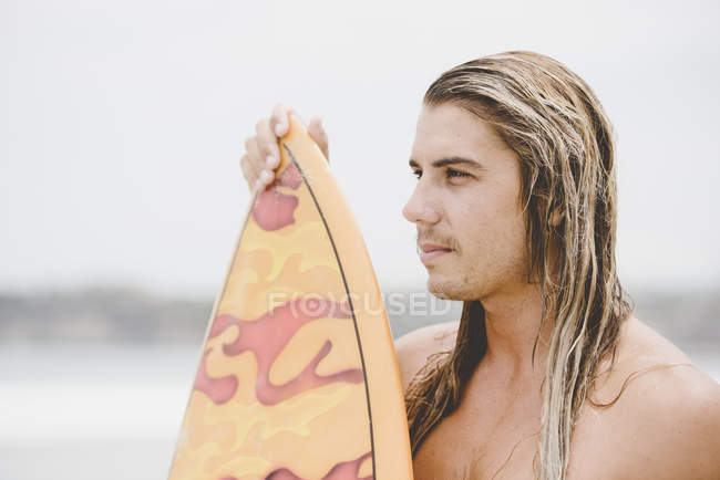 Australian surfer with surfboard — Stock Photo