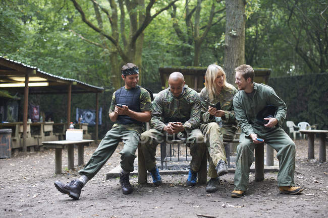 Paintball players taking a break after game — Stock Photo