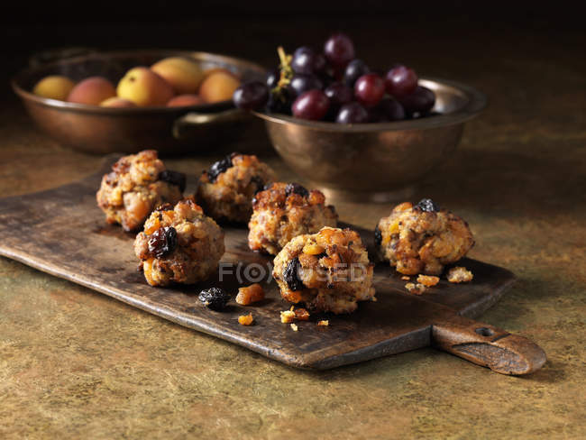 Festive Christmas ingredients of pork, apricot and jumbo flamed raisin stuffing with red grapes and apricots — Stock Photo