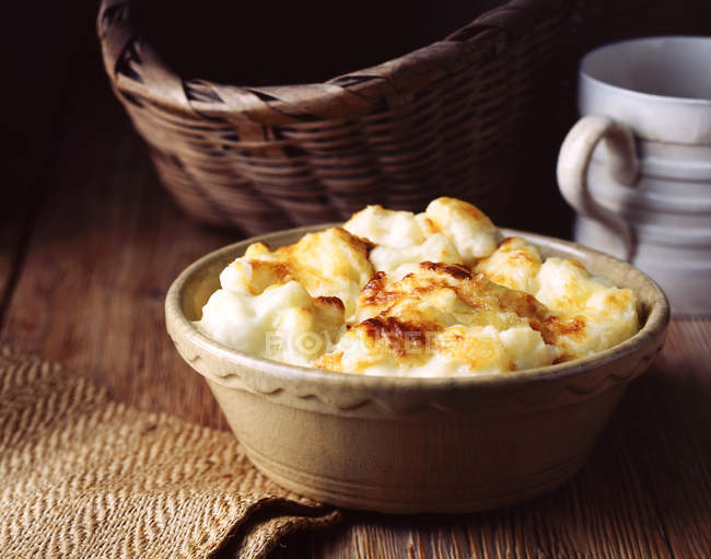 Home-made cauliflower cheese, baked in vintage bowl — Stock Photo
