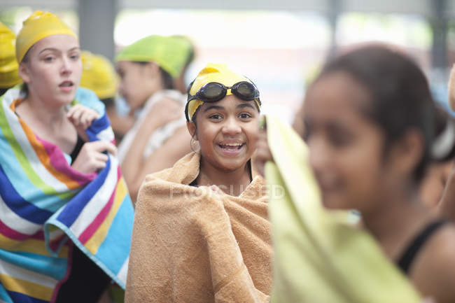 Group of schoolgirls wrapped in towels after swimming — Stock Photo