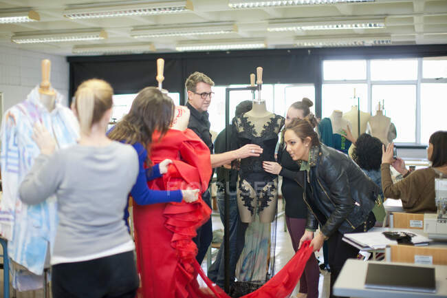 Fashion design teacher and students in class — Stock Photo