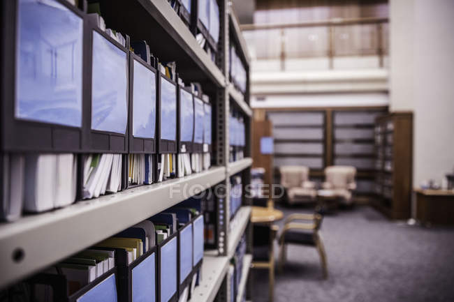 Rows of office shelves with files and paperwork — Stock Photo