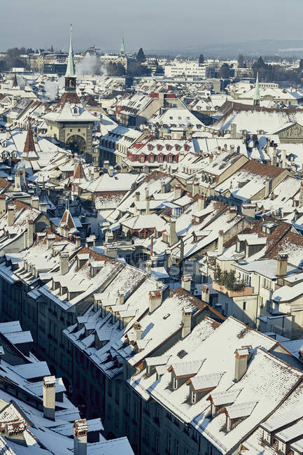 High angle city view with snow covered rooftops, Berne, Switzerland — Stock Photo