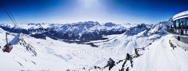 Panoramic view of ski lift in snow covered mountains, Sankt Moritz, Engadin, Switzerland — Stock Photo