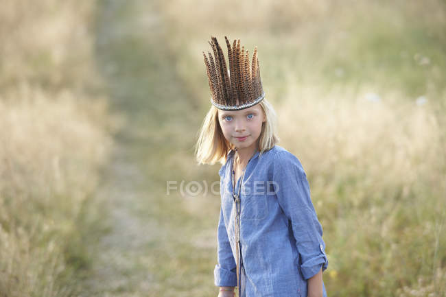 Portrait of girl in native american headdress — Stock Photo