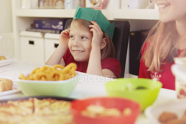 Little girl wearing paper crown at Christmas — Stock Photo