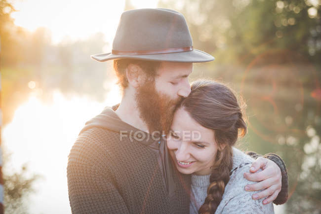 Young couple in sunlight — Stock Photo