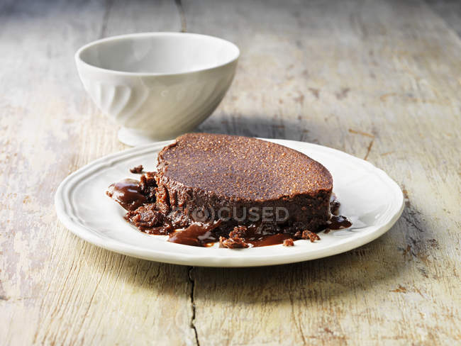 Hot chocolate fudge pudding on white plate — Stock Photo
