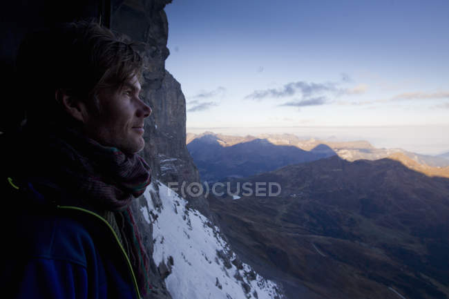 Close up of male hiker gazing at view, Jungfraujoch, Grindelwald, Switzerland — Stock Photo
