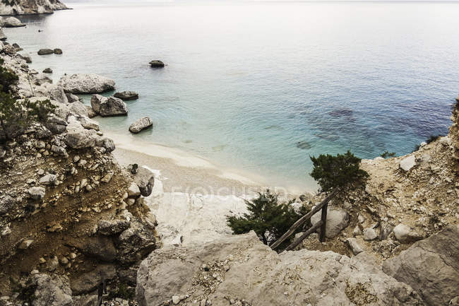 Elevated view of coastal cliffs and sea, Cala Goloritze, Sardinia, Italy — Stock Photo