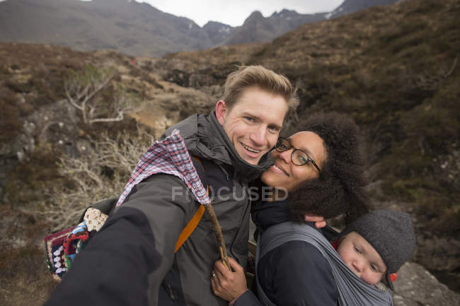 Family on hike, smiling towards camera — Stock Photo