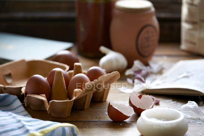 Eggs and salt on kitchen table, close-up view — Stock Photo