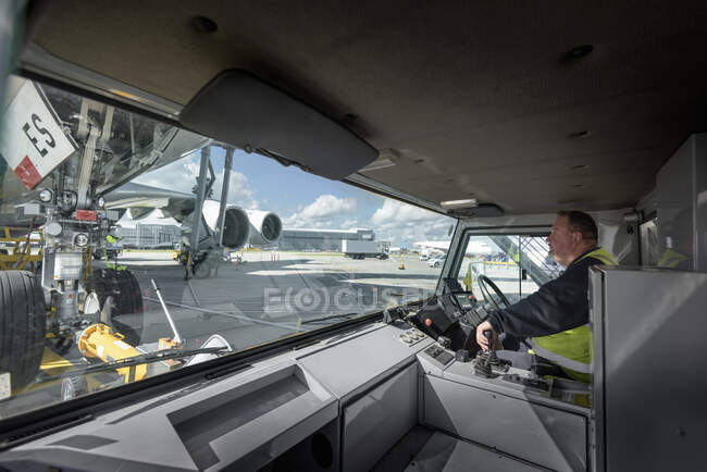 Tug driver towing A380 aircraft — Stock Photo