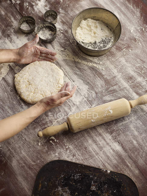 Cropped image of woman shaping scone dough — Stock Photo