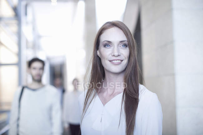 Portrait of mid adult businesswoman in conference centre — Stock Photo