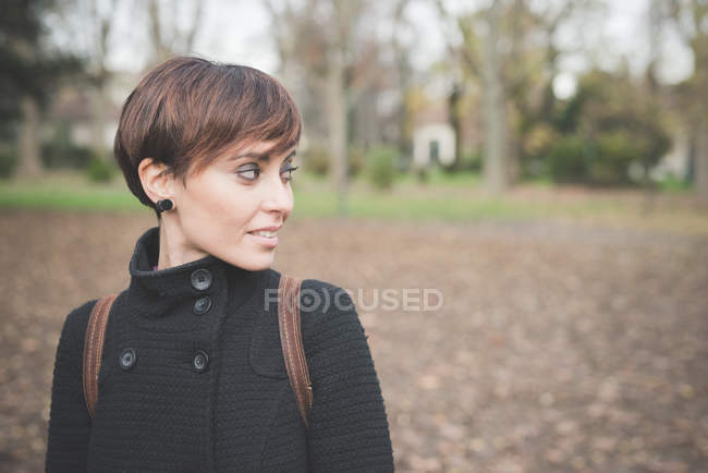 Portrait of Young woman in park — Stock Photo