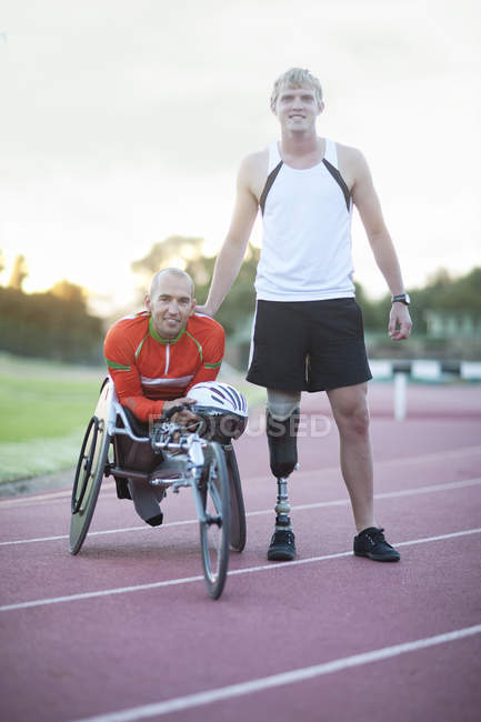 Male para-athletes on track at stadium — Stock Photo