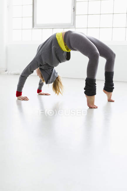 Young woman in yoga position — Stock Photo