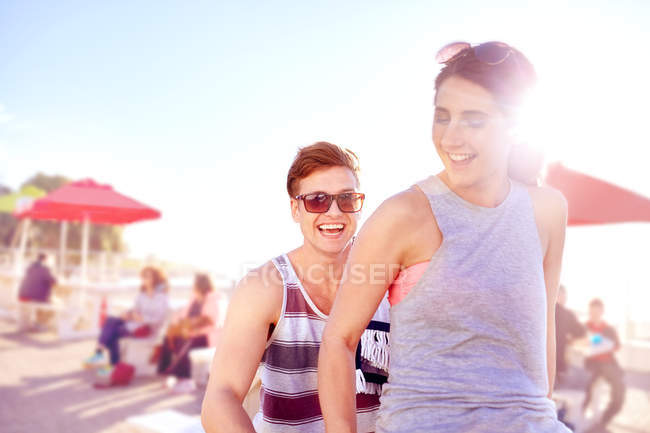 Couple riding bicycle smiling — Stock Photo