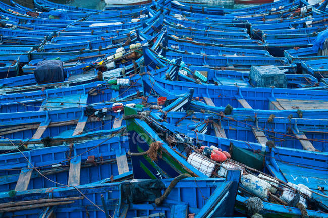 Blue boats docked in harbor — Stock Photo
