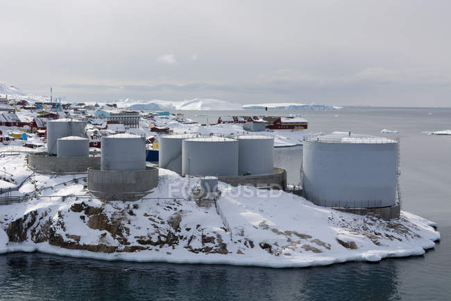 Elevated view of snow covered oil tanks at Ilulissat, Greenland — Stock Photo