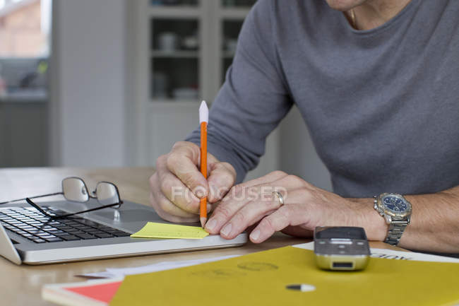 Close up of mature businessman working from home — Stock Photo