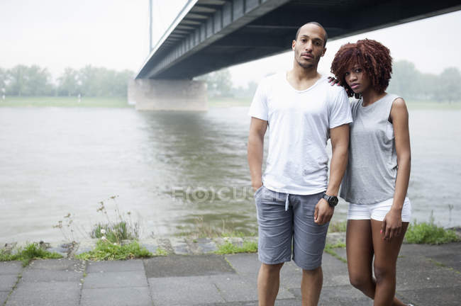 Portrait of young couple by bridge, Dusseldorf, Germany — Stock Photo