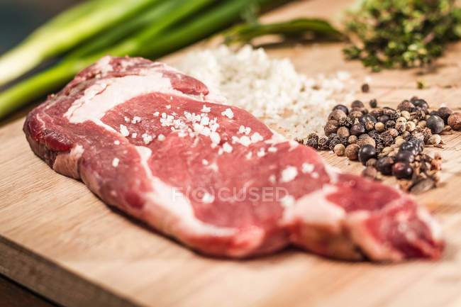 Seasoned meat on board — Stock Photo